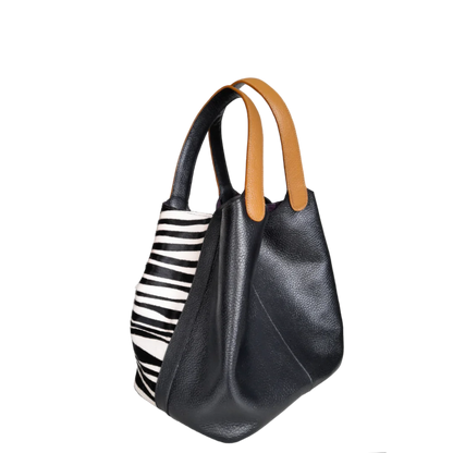 Bolso en cuero para mujer color negro con pelo cebra blanco por negro